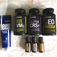 A photograph of doTERRA products in brown bottles including vitamins, minerals and energy complex supplements and three essential oils saying Copaiba, Turmeric and Wild Orange