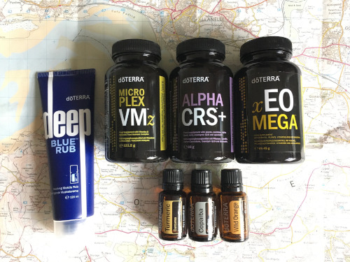 A photograph of doTERRA products in brown bottles including vitamins, minerals and energy complex supplements and three essential oils saying Copaiba, Turmeric and Wild Orange